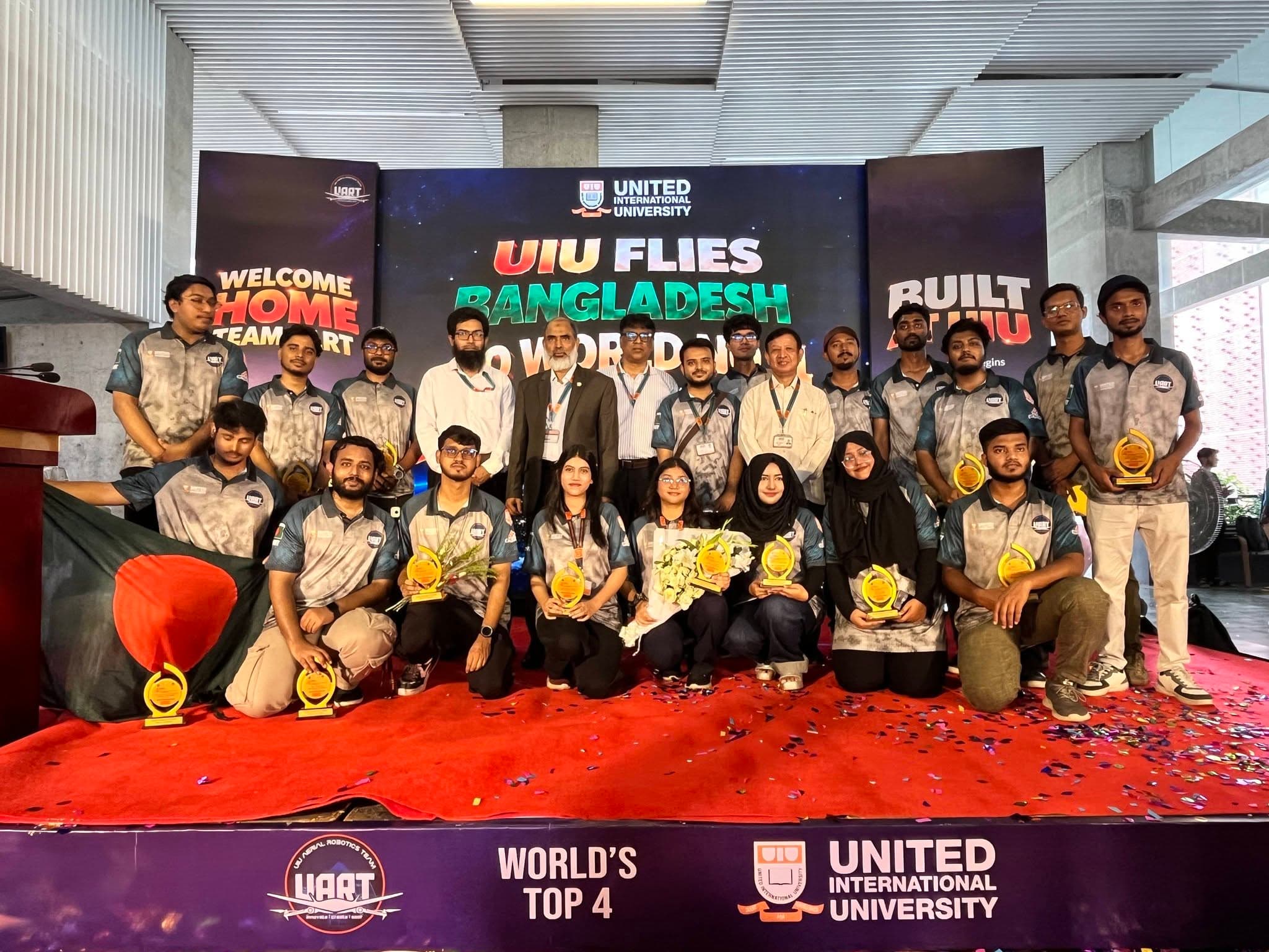 UIU UAV team with awards and World's Top 4 banner